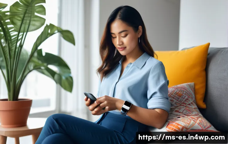 예방 중심 헬스케어의 진단 도구 - A modern Malaysian woman wearing a smart casual outfit, sitting comfortably at home while checking h...